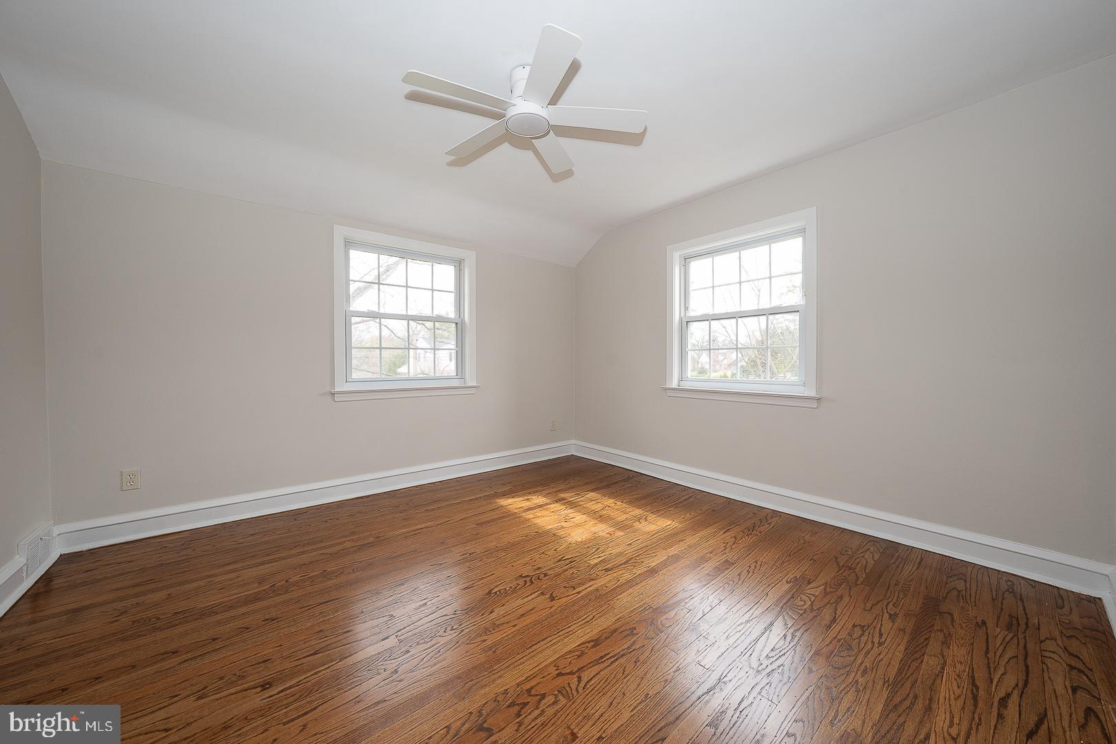 298 Strafford Avenue Wayne, PA 19087 - Photo 33 of 41 a view of an empty room with wooden floor and a window