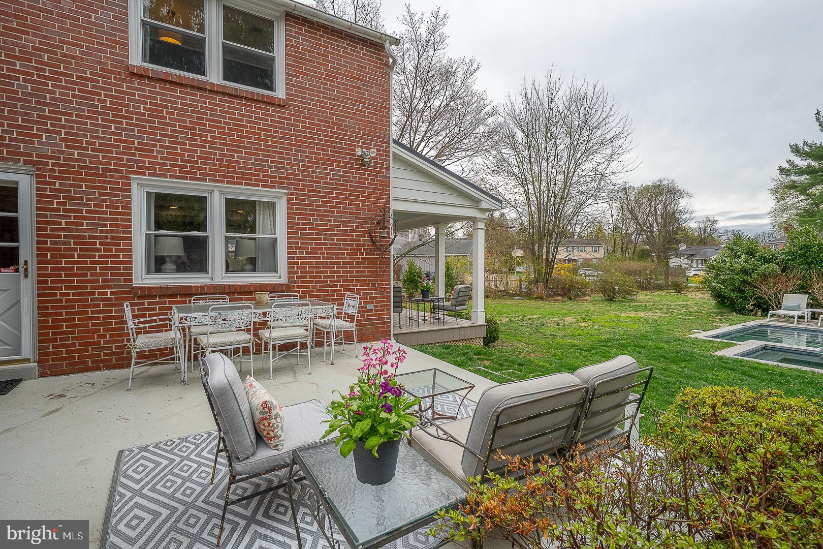 298 Strafford Avenue Wayne, PA 19087 - Photo 37 of 41 a view of a house with backyard sitting area and garden
