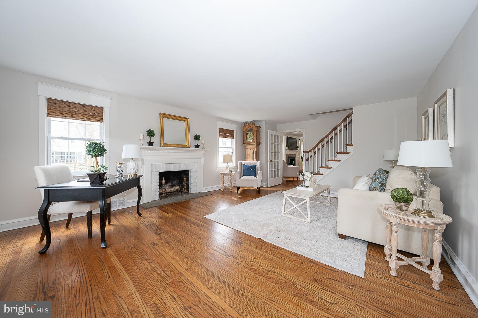 298 Strafford Avenue Wayne, PA 19087 - Photo 5 of 41 a living room with furniture a fireplace and wooden floor