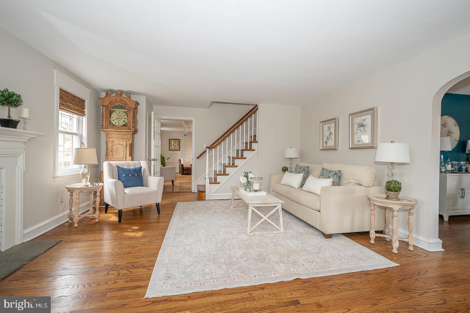 298 Strafford Avenue Wayne, PA 19087 - Photo 7 of 41 a living room with fireplace furniture and a wooden floor