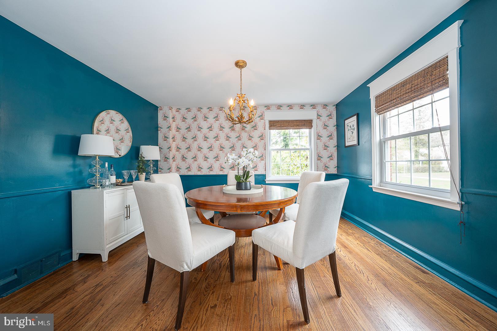 298 Strafford Avenue Wayne, PA 19087 - Photo 8 of 41 a dining room with furniture a chandelier and wooden floor