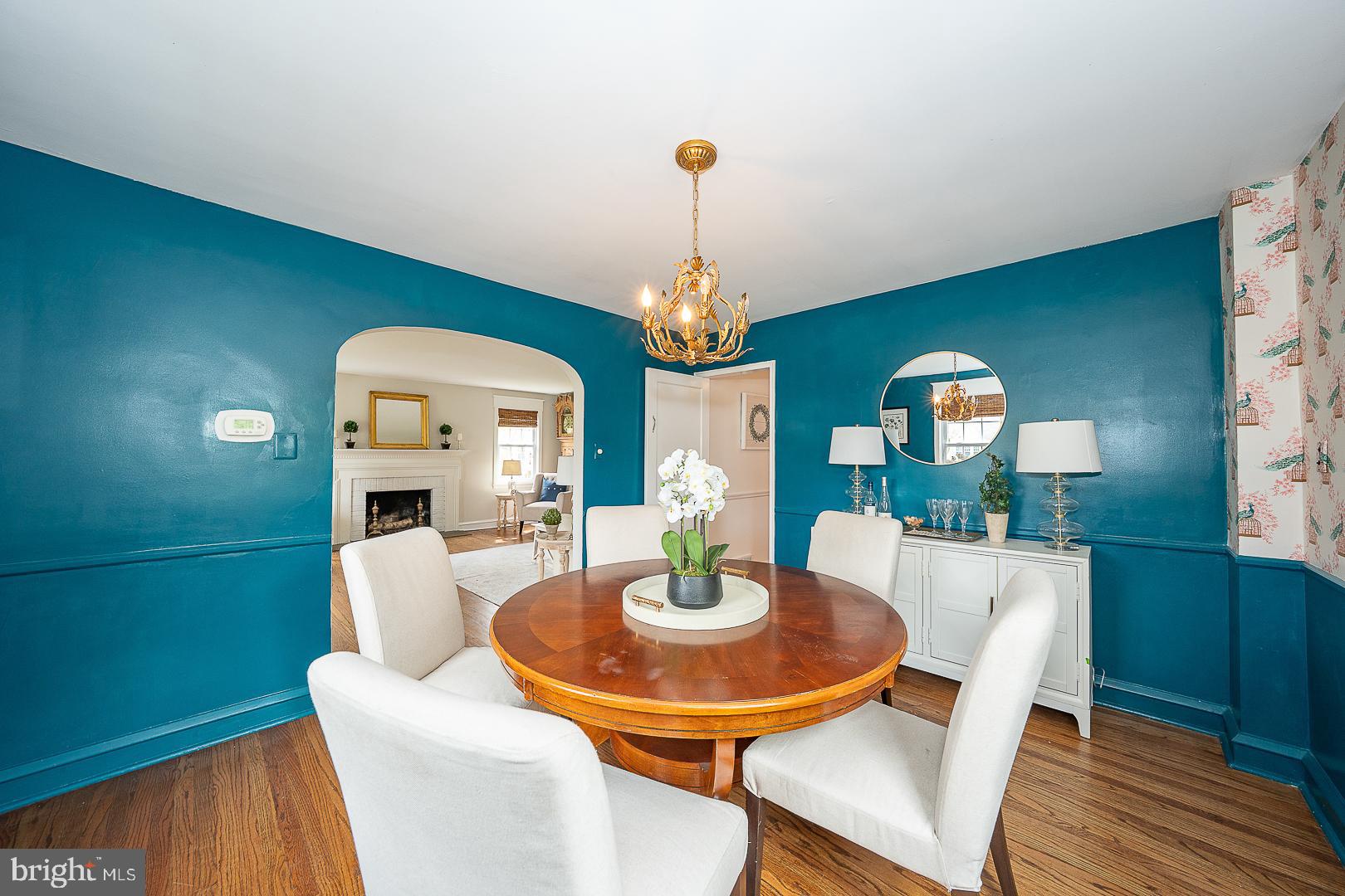 298 Strafford Avenue Wayne, PA 19087 - Photo 9 of 41 a dining room with furniture a rug and wooden floor