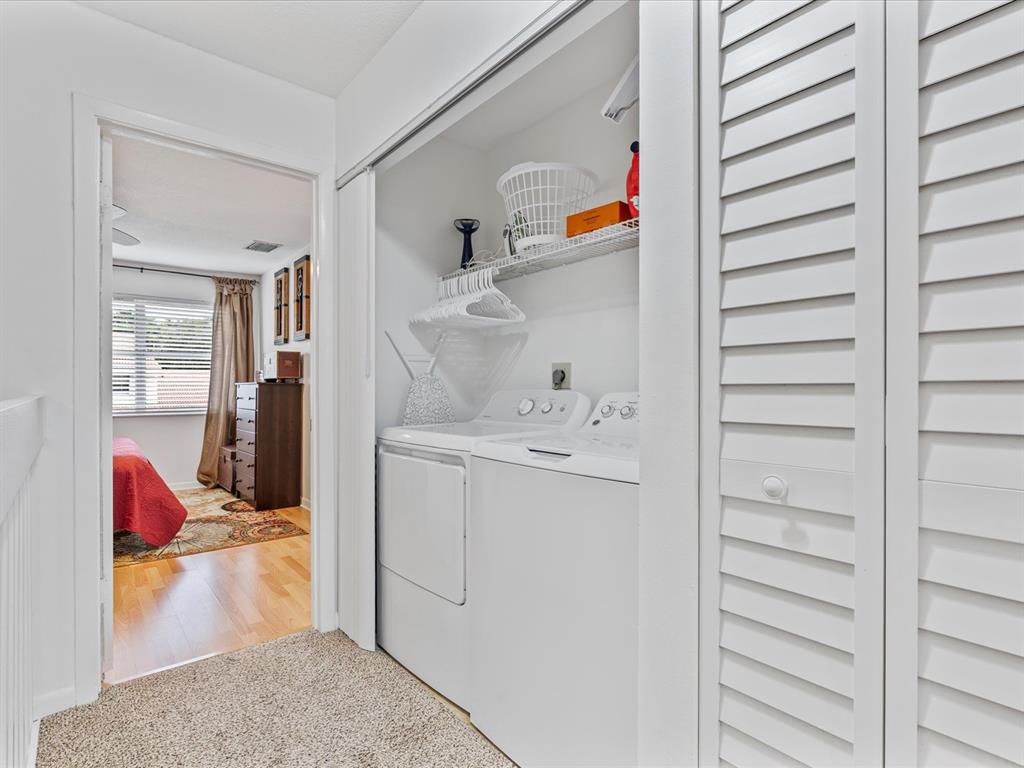 6273 Walk Circle Boca Raton, FL 33433 - Photo 13 of 25 a utility room with cabinets washer and dryer