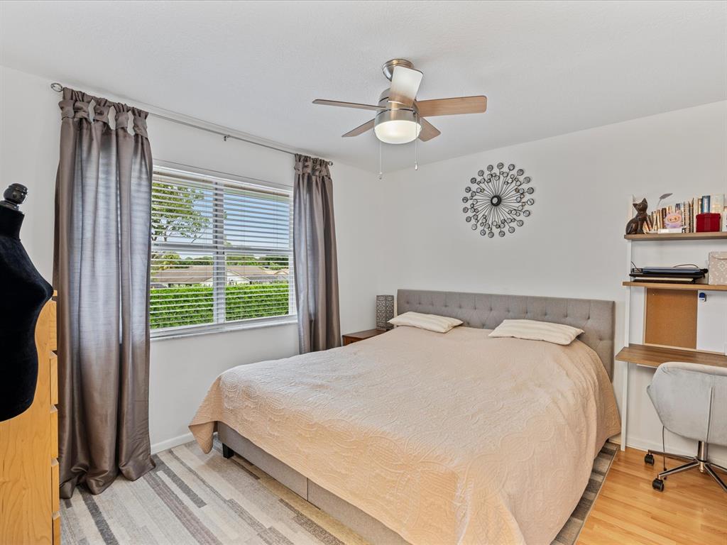 6273 Walk Circle Boca Raton, FL 33433 - Photo 14 of 25 a bedroom with a bed dresser and a window