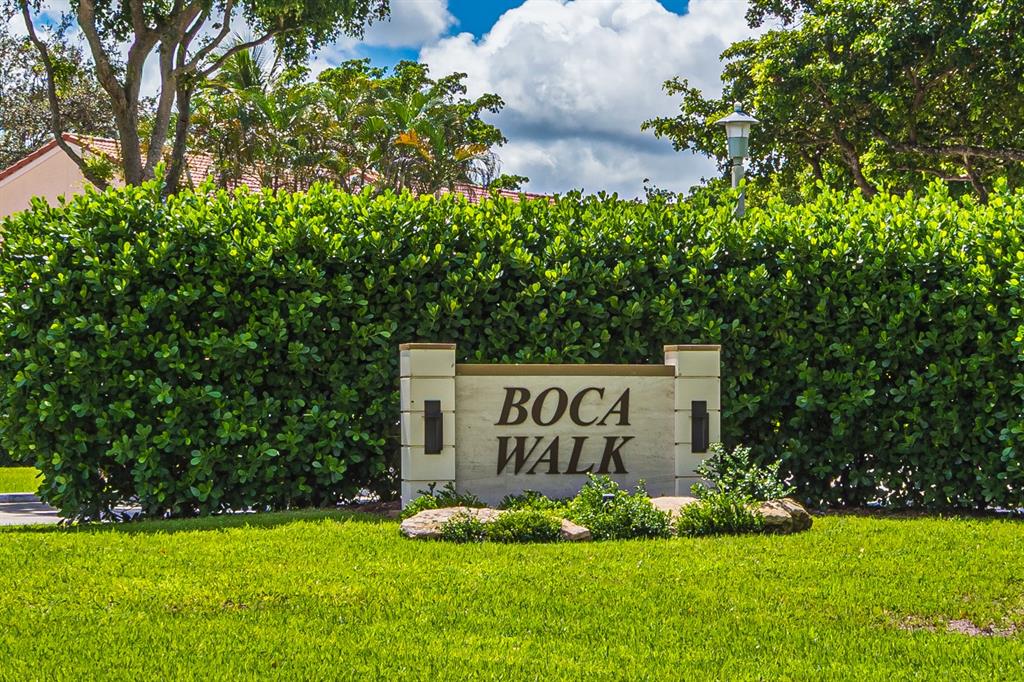 6273 Walk Circle Boca Raton, FL 33433 - Photo 25 of 25 a sign of golf club on a wall under a tree