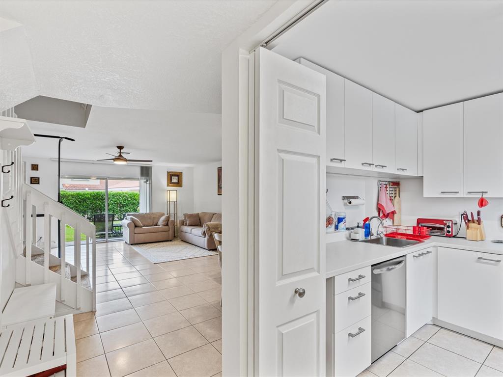 6273 Walk Circle Boca Raton, FL 33433 - Photo 5 of 25 a view of a kitchen center island and living room
