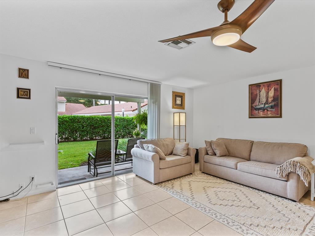6273 Walk Circle Boca Raton, FL 33433 - Photo 8 of 25 a living room with furniture and a large window