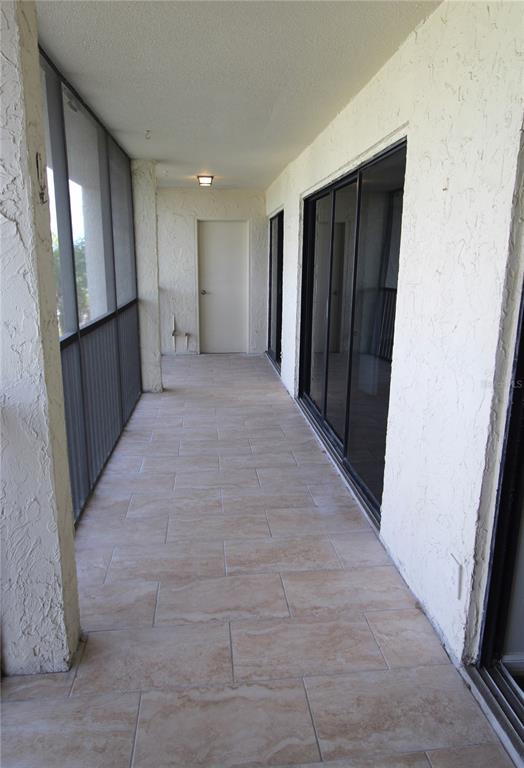 4119 61st Ave Terrace West, Unit 407 Bradenton, FL 34210 - Photo 16 of 19 a view of hallway with an entryway