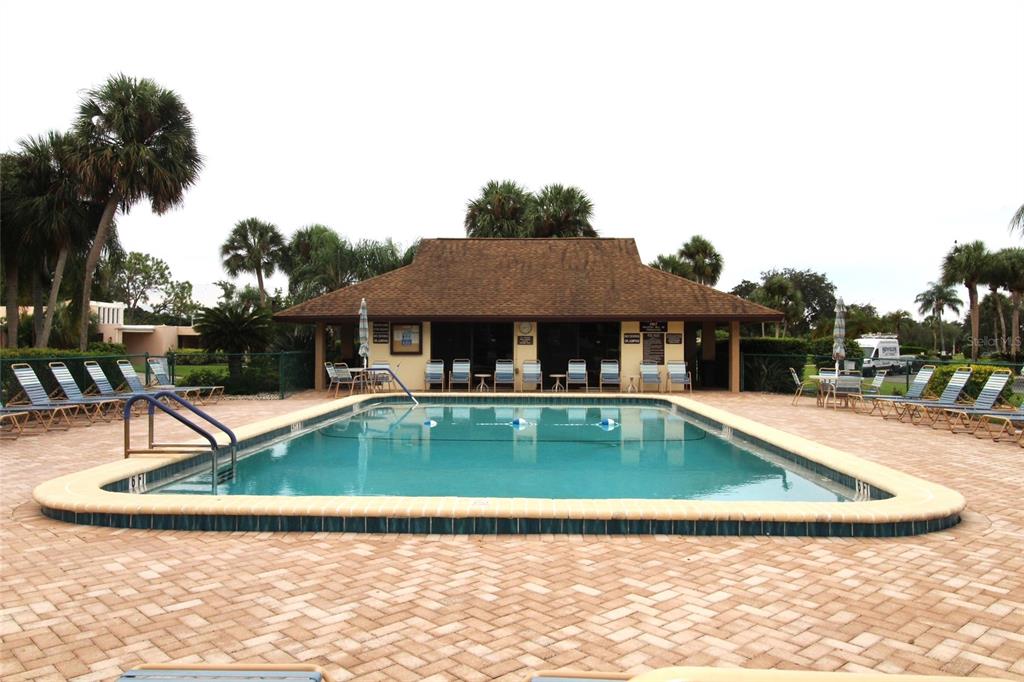 4119 61st Ave Terrace West, Unit 407 Bradenton, FL 34210 - Photo 19 of 19 a view of a house with swimming pool