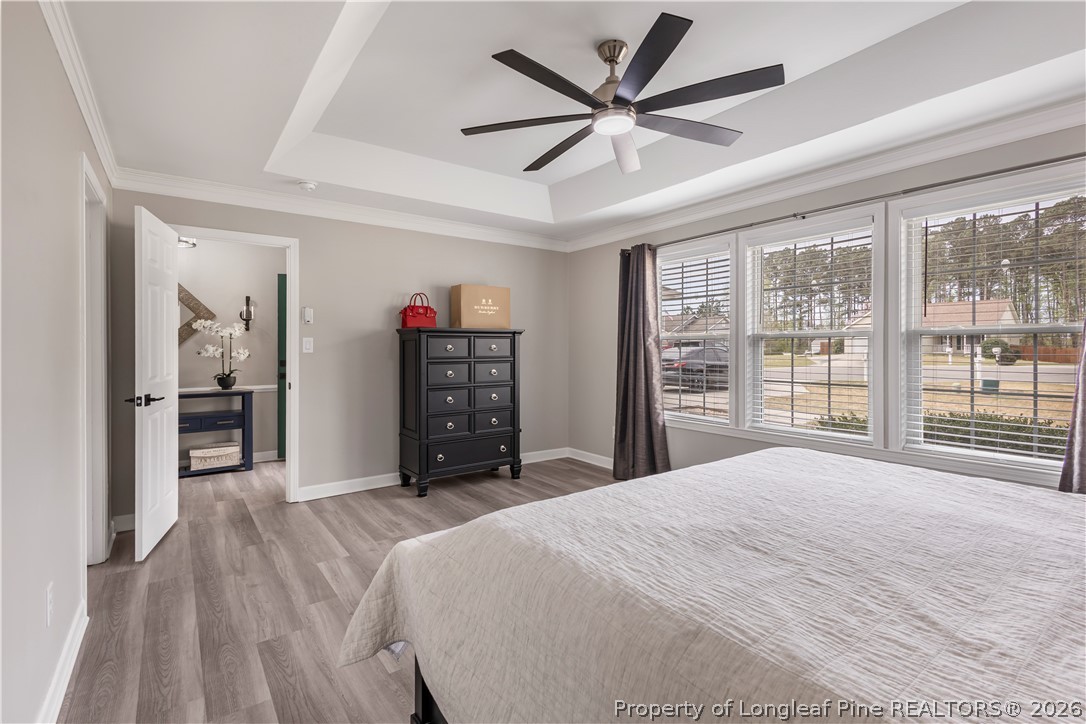 253 Farmstead Court Rockingham, NC 28379 - Photo 8 of 25 a bedroom with a large bed and a large window