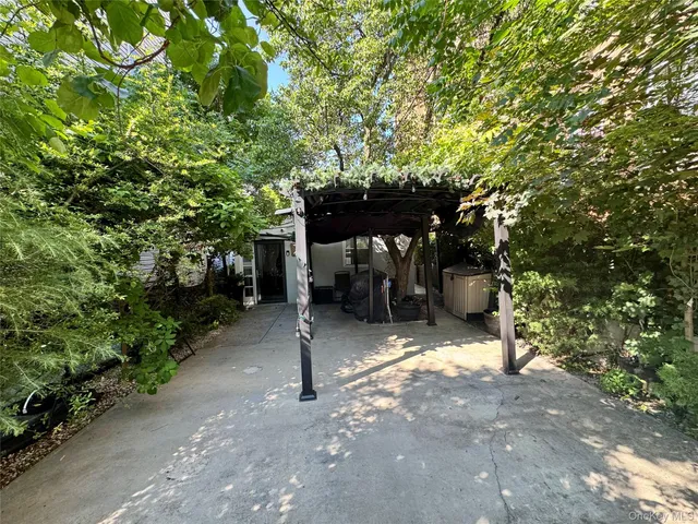a view of a street with a tree