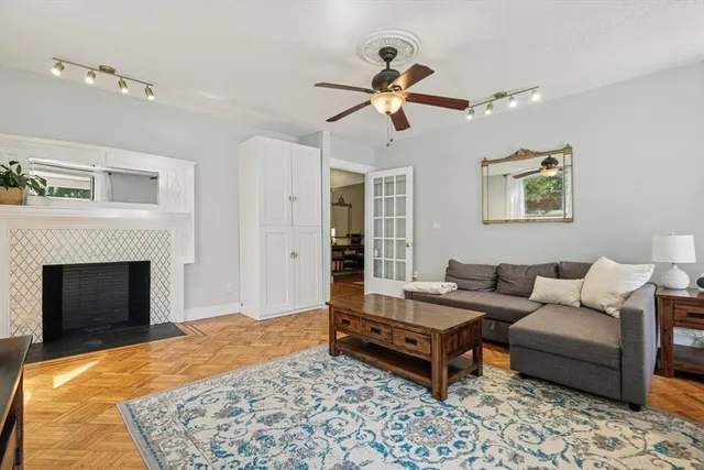 a living room with furniture and a fireplace