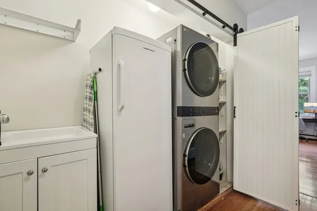a close view of a utility room with dryer and washer