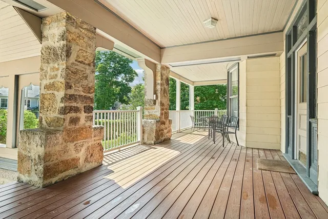 a view of a balcony with wooden floor