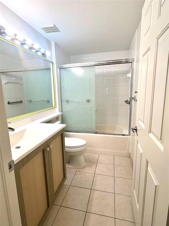 8060 North Nob Hill Road, Unit 206 Tamarac, FL 33321 - Photo 11 of 16 a bathroom with a sink a toilet and shower