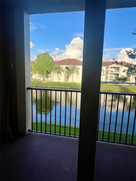 8060 North Nob Hill Road, Unit 206 Tamarac, FL 33321 - Photo 14 of 16 a view of a porch