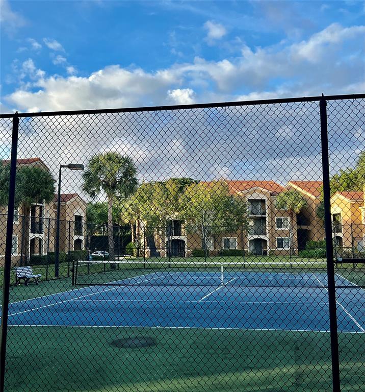 8060 North Nob Hill Road, Unit 206 Tamarac, FL 33321 - Photo 16 of 16 a garden view with a playing court