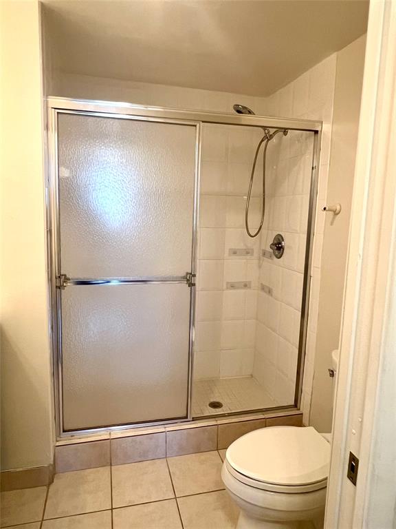 8060 North Nob Hill Road, Unit 206 Tamarac, FL 33321 - Photo 7 of 16 a bathroom with a granite countertop shower and a toilet