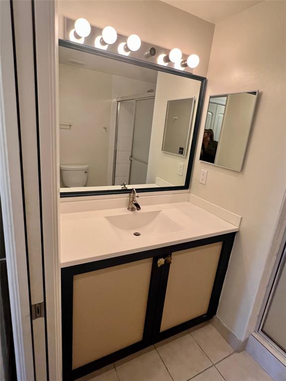 8060 North Nob Hill Road, Unit 206 Tamarac, FL 33321 - Photo 8 of 16 a bathroom with a sink and a mirror