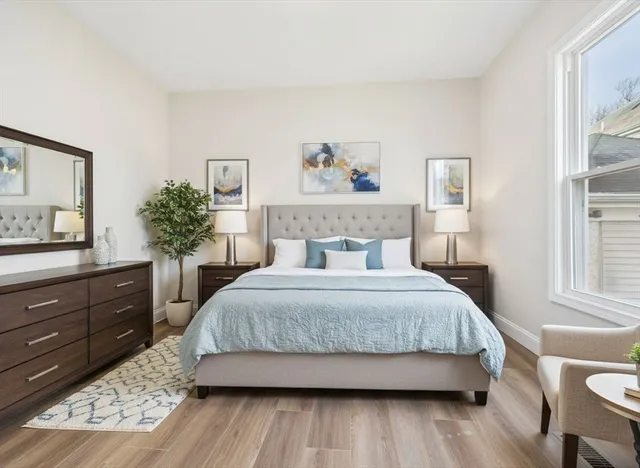 a bedroom with a bed and a dresser