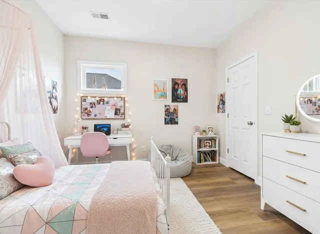 a bedroom with a bed and a cabinets