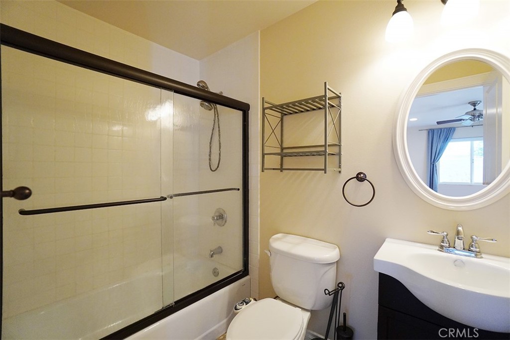 14722 Comet Street Irvine, CA 92604 - Photo 11 of 22 a bathroom with a sink mirror vanity and toilet