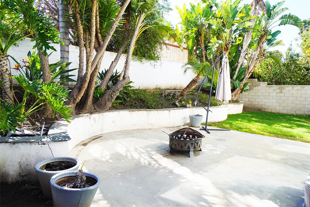 14722 Comet Street Irvine, CA 92604 - Photo 22 of 22 a view of a backyard with plants and a lake view