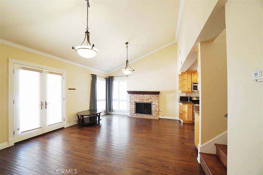14722 Comet Street Irvine, CA 92604 - Photo 5 of 22 a view of empty room with wooden floor and fireplace