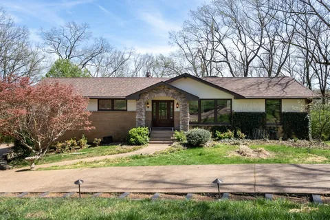 an aerial view of residential house with outdoor space