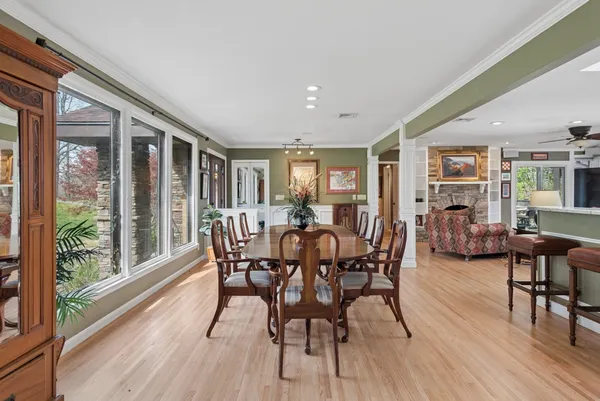a living room with furniture a ceiling fan and a rug