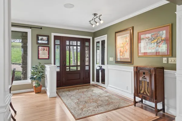 a living room with furniture fireplace and flat screen tv