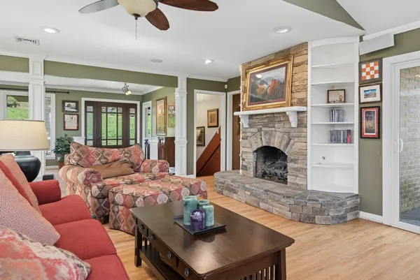 a kitchen with stainless steel appliances granite countertop a sink and dishwasher a stove top oven with white cabinets