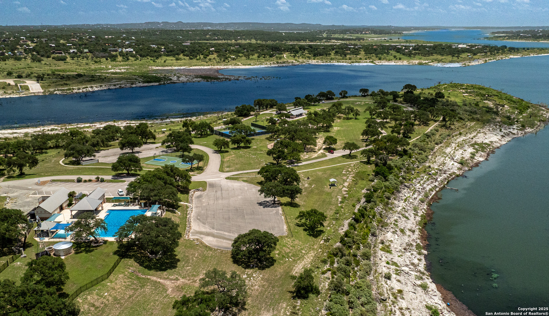 525 Rock Trail Place Spring Branch, TX 78070 - Photo 22 of 22 a view of a lake with a mountain