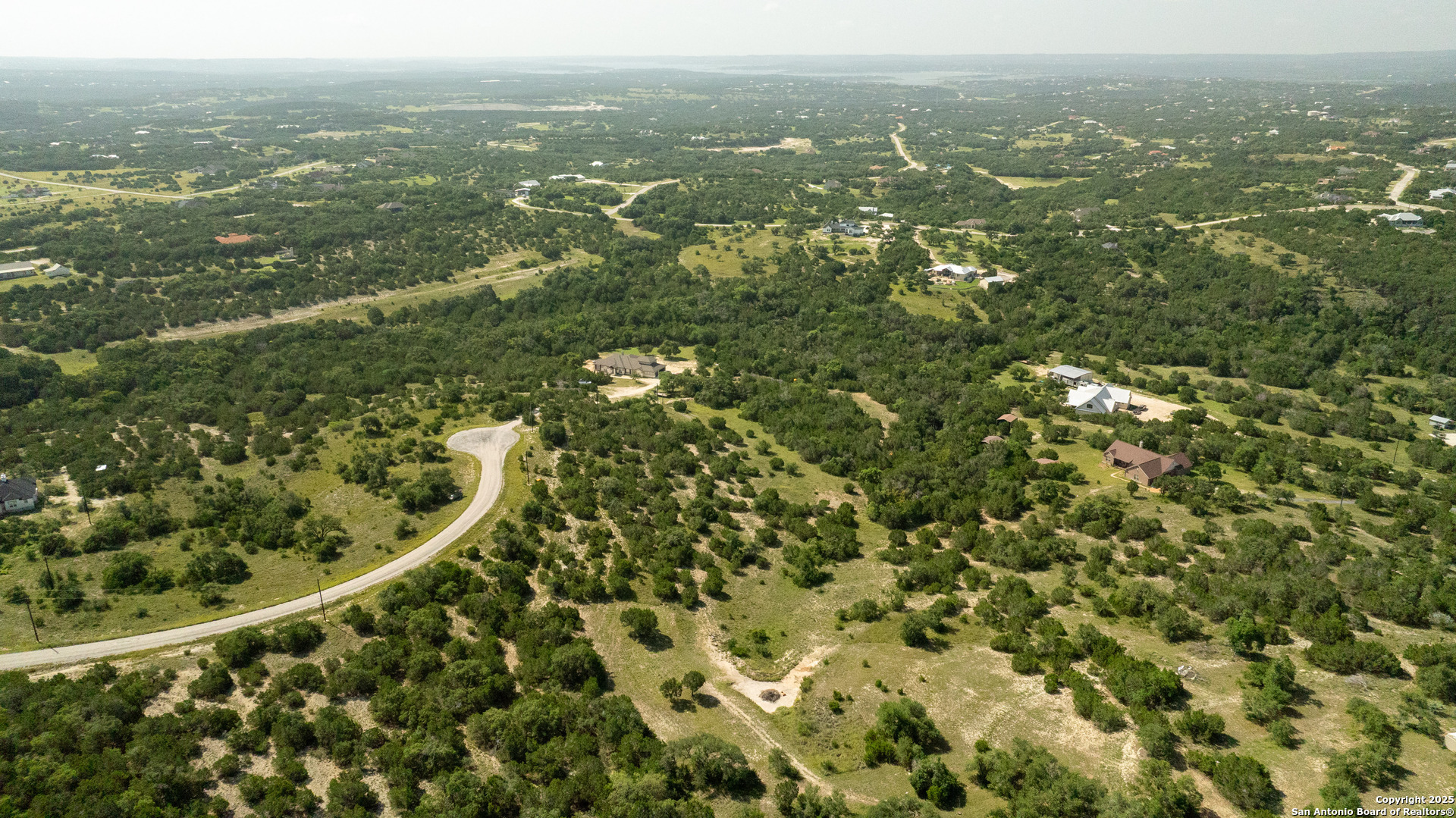 525 Rock Trail Place Spring Branch, TX 78070 - Photo 9 of 22 an aerial view of residential houses with outdoor space and trees