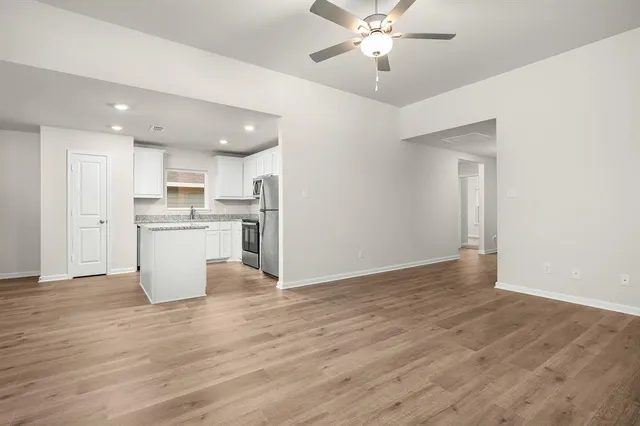 a view of kitchen with wooden floor