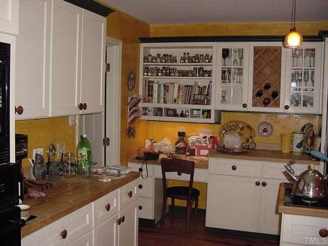 11612 Appaloosa Run West Raleigh, NC 27613 - Photo 5 of 12 a kitchen with a sink and cabinets