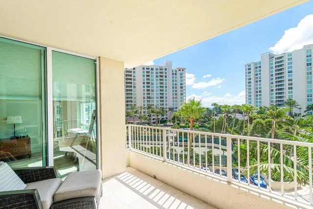 a view of balcony with furniture