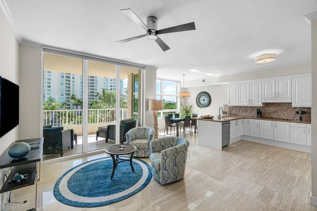 a living room with furniture wooden floor and a flat screen tv
