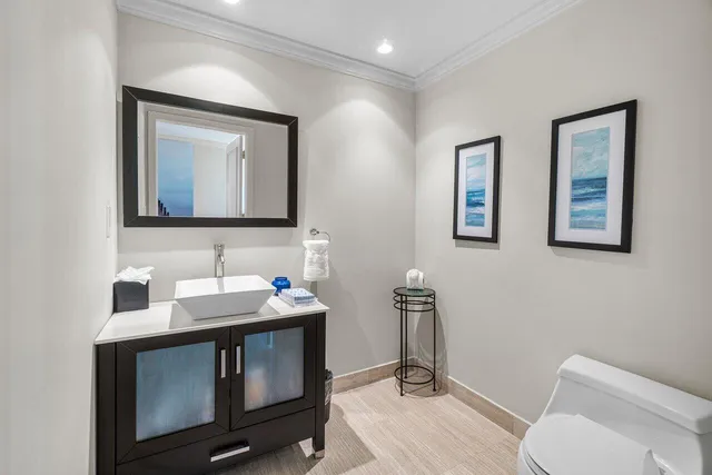 a bedroom with a bed a dresser next to a window