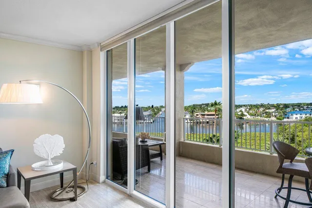 a view of a glass door with a tree