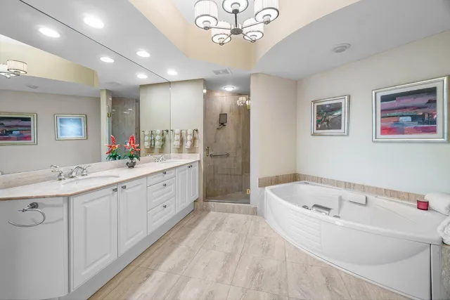 a bathroom with a toilet a sink and glass door