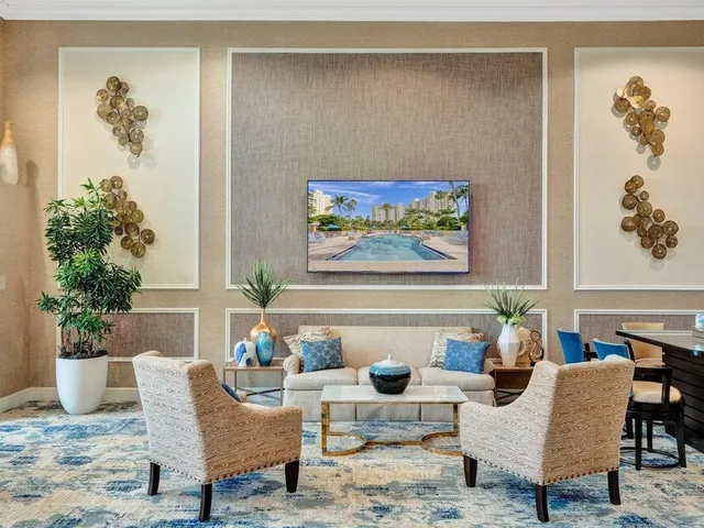 a living room with furniture and white walls