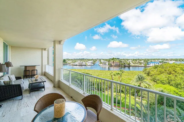 a view of a lake with boats and trees