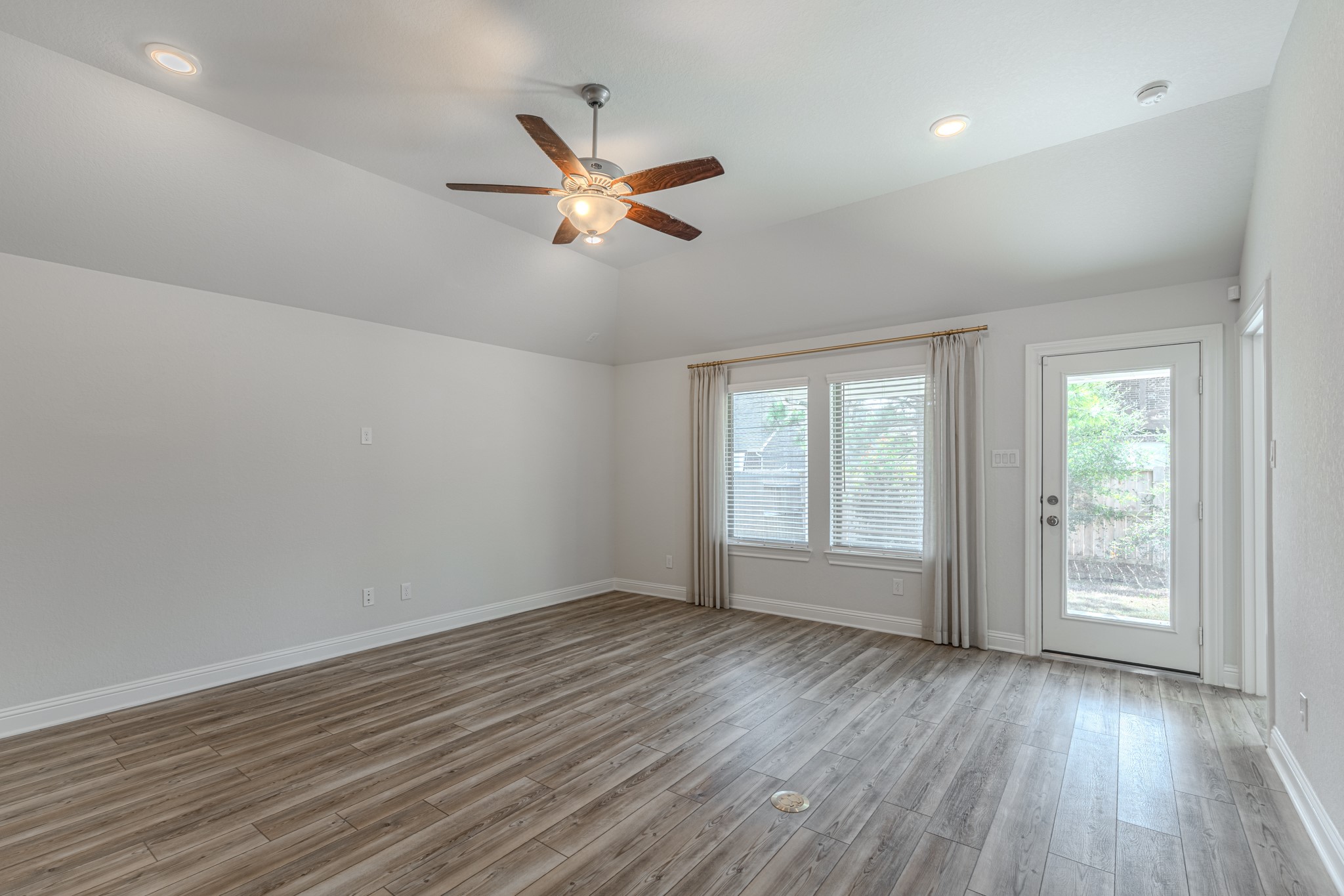 9840 Sweet Flag Court Conroe, TX 77385 - Photo 22 of 50 Open sightlines throughout the home enhance natural light and create an airy, spacious feel in every main living area.