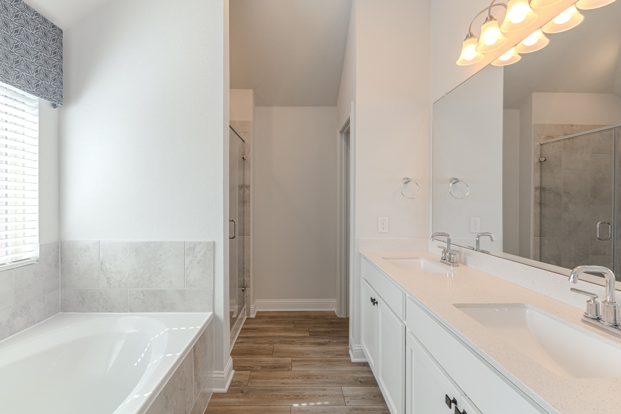 9840 Sweet Flag Court Conroe, TX 77385 - Photo 28 of 50 Thoughtfully designed primary bath creates a true retreat experience, blending modern finishes with functional storage and everyday luxury.