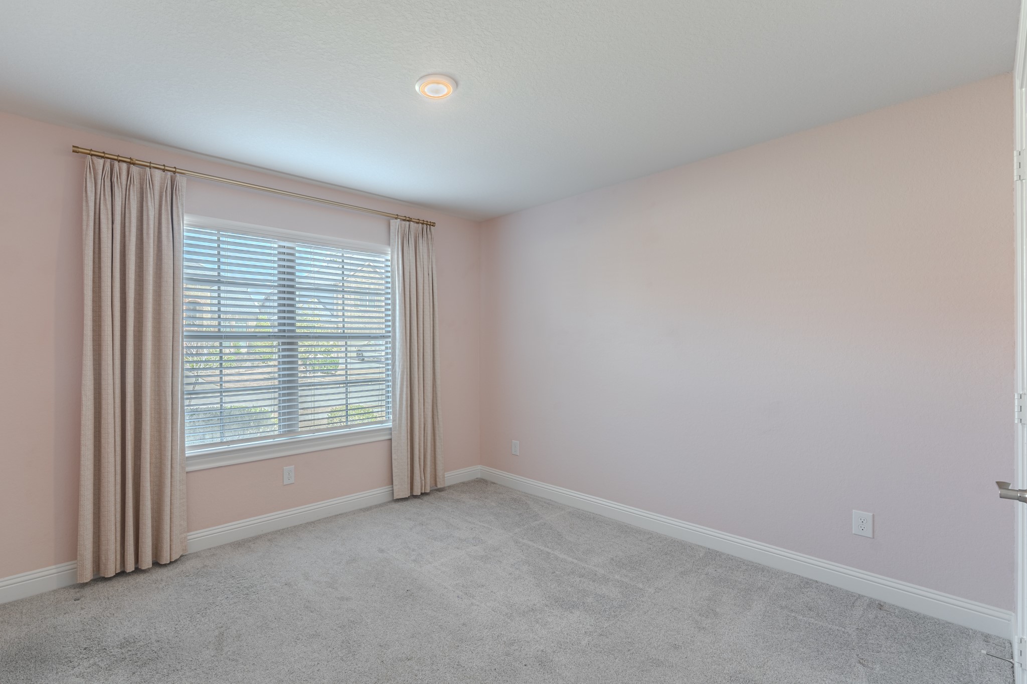 9840 Sweet Flag Court Conroe, TX 77385 - Photo 33 of 50 Secondary bedrooms are generously sized, offering flexibility for guests, children, or creating a home office or hobby space.