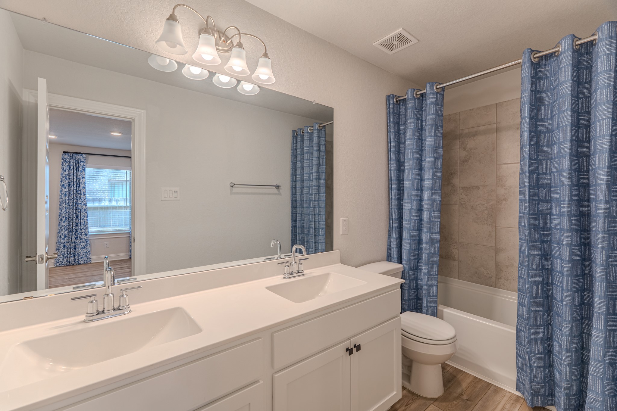 9840 Sweet Flag Court Conroe, TX 77385 - Photo 35 of 50 Three full bathrooms offer convenience and comfort for family members and guests alike, finished with modern touches throughout.