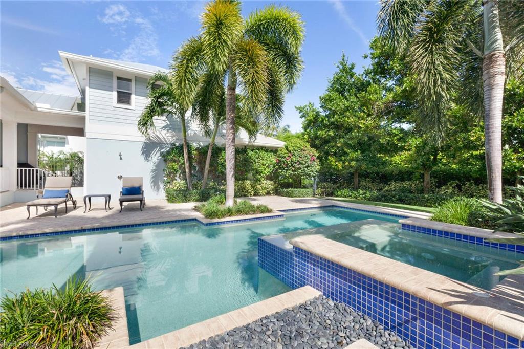 150 Central Avenue Naples, FL 34102 - Photo 19 of 35 a view of a house with pool