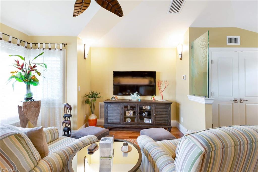 150 Central Avenue Naples, FL 34102 - Photo 26 of 35 a living room with furniture and a flat screen tv