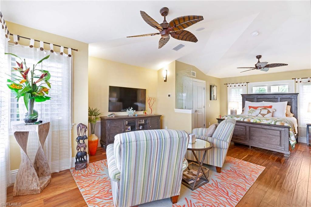 150 Central Avenue Naples, FL 34102 - Photo 27 of 35 a living room with furniture and a flat screen tv